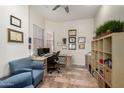 Home office with built-in shelving and comfortable seating at 4324 S Primrose Dr, Gold Canyon, AZ 85118