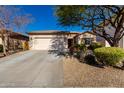 Single-story home with a two-car garage and nicely landscaped front yard at 5512 W Cavedale Dr, Phoenix, AZ 85083