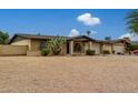 Landscaped front yard with a single story home and a two-car garage at 5530 N 47Th Ave, Glendale, AZ 85301