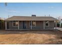 Recently updated single story home with a covered porch at 6443 E Alder Ave, Mesa, AZ 85206