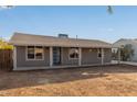 Newly renovated home with covered porch and large yard at 6443 E Alder Ave, Mesa, AZ 85206