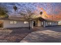 Stunning curb appeal with a large driveway and desert landscaping at 6613 W Sweetwater Ave, Glendale, AZ 85304