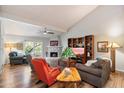 Bright living room featuring a fireplace and built-in shelving at 7438 E Hum Rd # 101, Carefree, AZ 85377