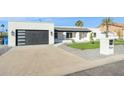 Contemporary home exterior with a large driveway at 9626 N 17Th Pl, Phoenix, AZ 85020