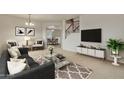 Living room featuring contemporary furniture and a large TV at 1036 E Oak Rd, San Tan Valley, AZ 85140