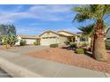 Single-story home with a two-car garage and desert landscaping at 10510 W Ross Ave, Peoria, AZ 85382