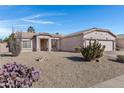 Single-story home with desert landscaping and two-car garage at 1102 E Bartlett Way, Chandler, AZ 85249