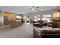 Open kitchen with island and stainless steel appliances at 1102 E Bartlett Way, Chandler, AZ 85249