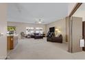 Spacious living room with comfortable seating and carpet at 1102 E Bartlett Way, Chandler, AZ 85249