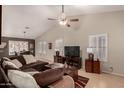 Open living space with a comfortable sectional sofa and hardwood floors at 1350 W Seascape Dr, Gilbert, AZ 85233