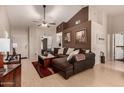 Spacious living room featuring a sectional sofa and light hardwood floors at 1350 W Seascape Dr, Gilbert, AZ 85233