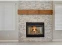 Stone fireplace with a wood mantel at 1656 E Montoya Ln, Phoenix, AZ 85024