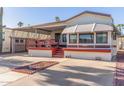 Single-wide mobile home with covered patio and carport at 17200 W Bell Rd # 439, Surprise, AZ 85374