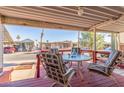 Covered patio with table and chairs, overlooking community at 17200 W Bell Rd # 439, Surprise, AZ 85374
