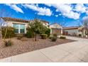 Charming house with neat landscaping and a two-car garage. Part of a neighborhood at 18346 W Coolidge St, Goodyear, AZ 85395