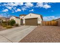 Beautiful one-story house with a two-car garage and well-maintained landscaping at 18346 W Coolidge St, Goodyear, AZ 85395