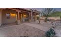 Charming front yard with a walkway leading to the house, featuring desert landscaping at 20918 E Orchard Ln, Queen Creek, AZ 85142