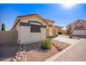 House exterior showcasing a two-car garage and well-maintained landscaping at 2287 E Hazeltine Way, Chandler, AZ 85249