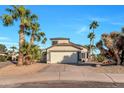 Two-story house with a two-car garage and mature landscaping at 3024 E Siesta Ln, Phoenix, AZ 85050