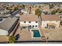 Two-story house with a pool and backyard, in a residential area at 30313 W Mitchell Ave, Buckeye, AZ 85396