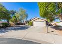 Single-story home with attached garage and mature landscaping at 4206 E Ellis Cir, Mesa, AZ 85205