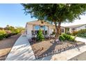 Mobile home with carport and nicely landscaped yard at 437 E Germann Rd # 24, San Tan Valley, AZ 85140
