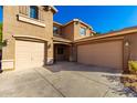Two-story house with a two-car attached garage and landscaping at 472 W Dragon Tree Ave, Queen Creek, AZ 85140