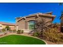 Two-story house with landscaped yard and attached garage at 472 W Dragon Tree Ave, Queen Creek, AZ 85140