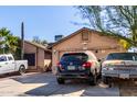 House exterior showcasing a two-car garage and landscaping at 8717 W Wilshire Dr, Phoenix, AZ 85037