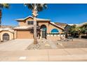 Two-story home with attractive landscaping and a large driveway at 926 E Mountain Sky Ave, Phoenix, AZ 85048