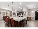 Spacious kitchen with large island, dark cabinetry, and stainless steel appliances at 962 S Jacob St, Gilbert, AZ 85296