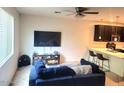 Spacious living room with large TV and comfortable seating at 125 N Sunvalley Blvd # 102, Mesa, AZ 85207