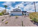 Landscaped front yard with desert plants and gravel at 1401 W Ocotillo Rd, Phoenix, AZ 85013