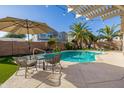 Stunning pool with patio furniture under a pergola at 14995 W Desert Hills Dr, Surprise, AZ 85379