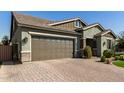 Two-car garage and attractive landscaping at 15320 W Baden St, Goodyear, AZ 85338
