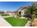 Landscaped yard and curb appeal at 15320 W Baden St, Goodyear, AZ 85338