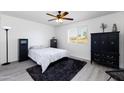Spacious bedroom with a comfortable bed and plenty of closet space at 2220 W Dora St # 215, Mesa, AZ 85201