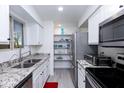 Modern kitchen featuring stainless steel appliances and granite countertops at 2220 W Dora St # 215, Mesa, AZ 85201