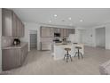 Spacious kitchen with stainless steel appliances, granite counters, large island with seating at 2937 E Lawndale Ct, Gilbert, AZ 85298