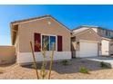 Newly built home with attractive landscaping and a two-car garage at 31550 N Hayweather Ln, San Tan Valley, AZ 85143