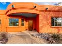 Inviting entryway with wood door and stone accents at 31825 N 141St St, Scottsdale, AZ 85262