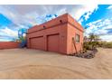 Attached three-car garage with spiral staircase at 31825 N 141St St, Scottsdale, AZ 85262