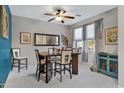 Bright dining room features a modern table and stylish decor at 42585 W Heavenly Pl, Maricopa, AZ 85138