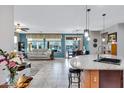 Open concept kitchen with granite island and stainless steel appliances at 42585 W Heavenly Pl, Maricopa, AZ 85138