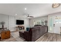 Spacious living room featuring a sectional sofa and wood-look floors at 5266 E Blanche Dr, Scottsdale, AZ 85254