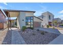 Contemporary home's exterior features a walkway and drought-tolerant landscaping at 817 E Monte Way, Phoenix, AZ 85042