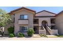 Two-story building exterior with Spanish-style architecture at 9115 E Purdue Ave # 111, Scottsdale, AZ 85258