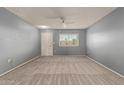 Spacious bedroom with neutral walls and carpet at 9459 N 111Th Ave, Sun City, AZ 85351