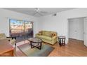 Living room with patio access and comfortable furnishings at 14950 W Mountain View Blvd # 6301, Surprise, AZ 85374