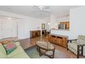 Living room features wood floors, entryway, and kitchen views at 14950 W Mountain View Blvd # 6301, Surprise, AZ 85374
